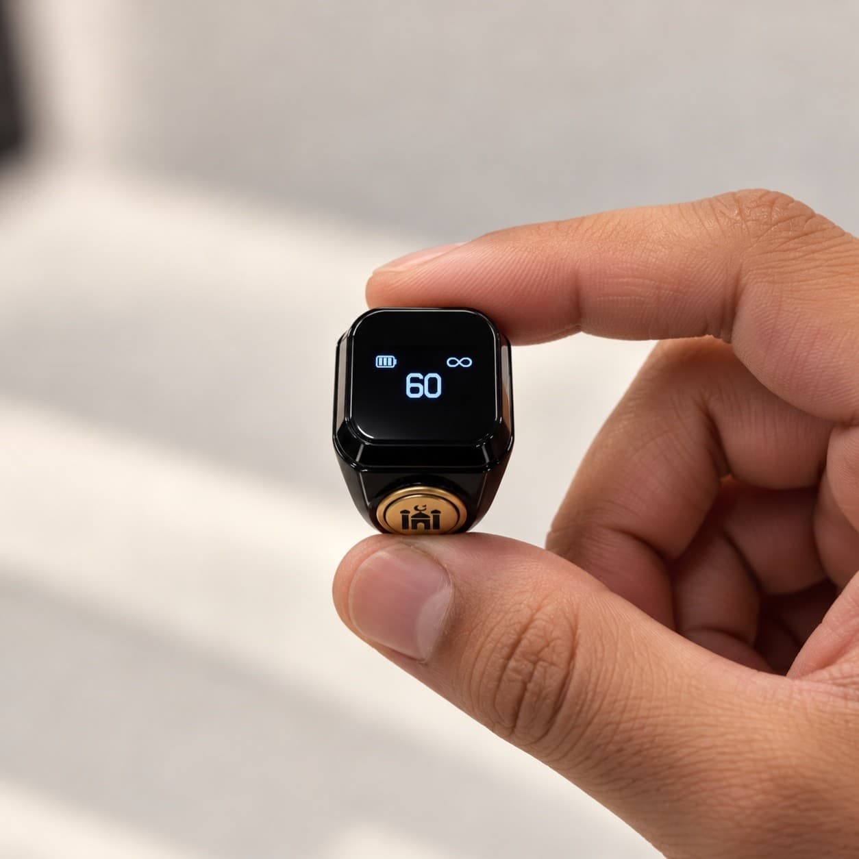 Dhikr Ring worn on a finger, showing the tap counter on its display